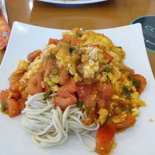 Egg and tomato over noodles