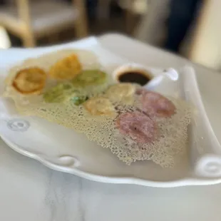 Colorful dumplings, pan fried. Two of each, chicken, pork, veggie, beef.