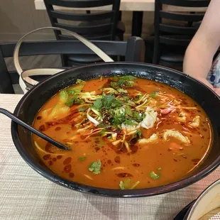 Spicy sesame noodles soup with chicken