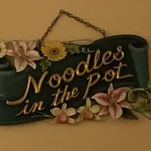 a sign hanging on a wall