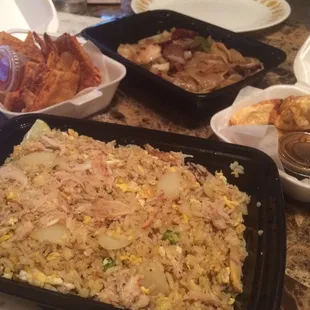 a tray of fried rice and other dishes