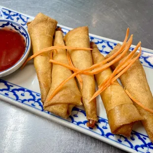 Golden Fried Shrimp Rolls with fresh coconut meat served with housemade plum saucevery tasty must try