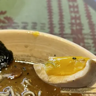 a bowl of ramen with a boiled egg