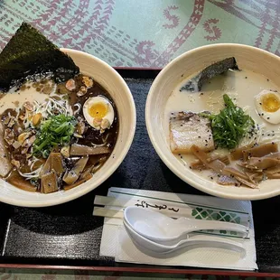 two bowls of ramen and a spoon