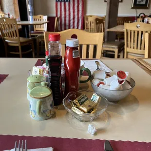 Table covered with trinkets and conversation starters.