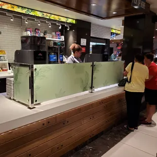 customers at the counter of a fast food restaurant