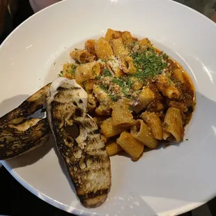 a plate of pasta with grilled eggplant