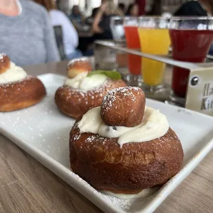 three doughnuts on a white plate