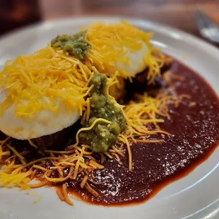 a plate of food with meat and cheese