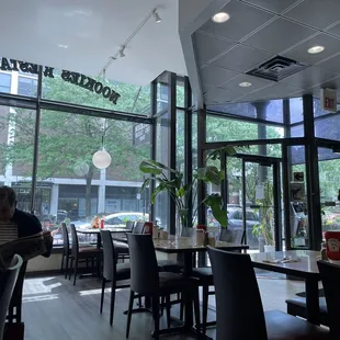 people sitting at tables in a restaurant