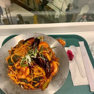 a plate of food on a tray