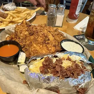 Chicken tenders and loaded baked potato