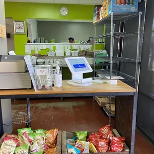 a cash register and a cart of chips