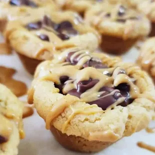 Peanut Butter Fudge Cups
A cupcake sized, soft baked, peanut butter cookie; filled with our triple chocolate fudge.