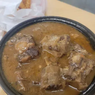 Oxtails smothered in gravy. So tender and delicious!!