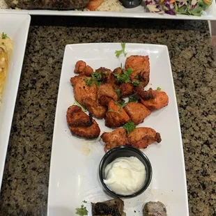 Top - Mix Kebab Platter (grilled chicken, kofta, &amp; lamb, served over a bed of basmati rice.) Bottom - Shawarma (+ additional kabob meat )