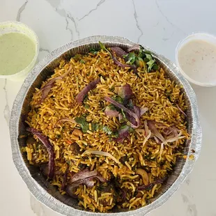 Lamb Biryani with Raita, creamy cilantro mint chutney