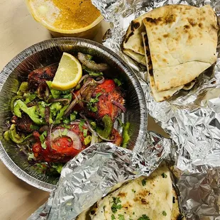 Butter Paneer Spicy Potatoes (Vegan) Tandoori Chicken (2 pcs) Garlic Naan
