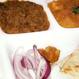 The "thali" containing a variety of items.