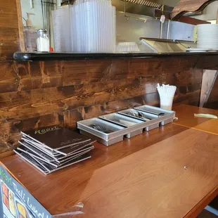a kitchen counter with cookbooks on it