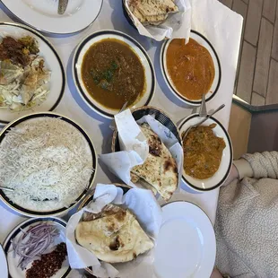 Naan, Butter chicken, Lamb Mughlai, Vegetable korma. Samosas, Vegetable Pakora. Side of red onion &amp; chilies