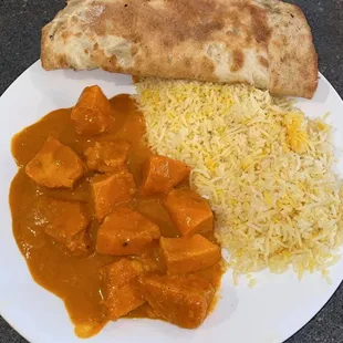 Butter chicken , basmati rice , and naan bread