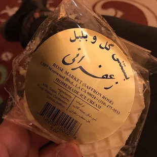 a person holding a piece of bread