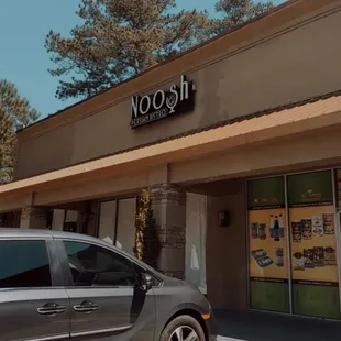 a car parked in front of a restaurant