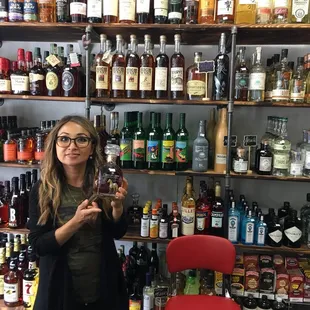 Sweet owner, holding a premium bottle of scotch