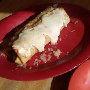 Nopalitos' Chile con carne chimichanga smothered in green. Too much cheese and too little Chile. But, it was good.