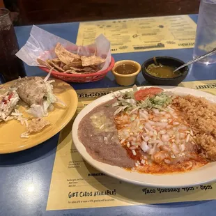 He said red cheese, onion, enchiladas with rice and beans and two ground beef crispy tacos.