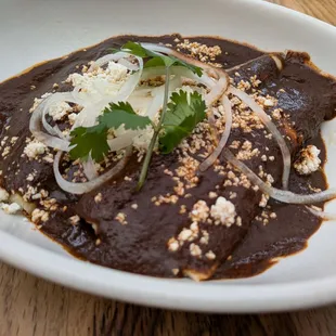 @endoedibles on Instagram 08/17/24
 
 ENMOLADAS - corn tortilla, queso fresco, mole poblano, onions, toasted sesame seeds