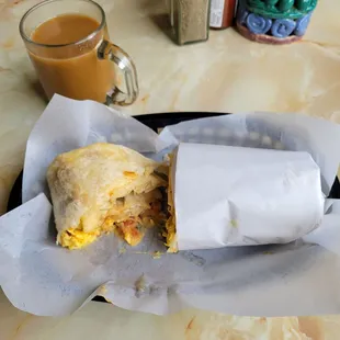 Burrito: potatoes, cheese, egg, onion sour cream and not much bacon.