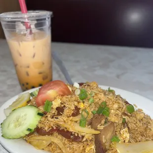 Stir fried rice with pork and Thai tea w/ boba SO GOOD 10/10 recommend !! Coming back for the lunch specials ..