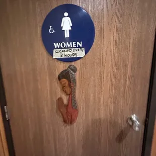 a women&apos;s restroom door