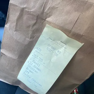 a receipt on the seat of a car