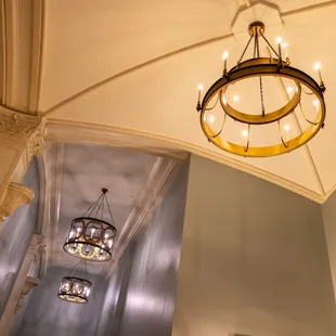 Chandeliers and high ceilings.
