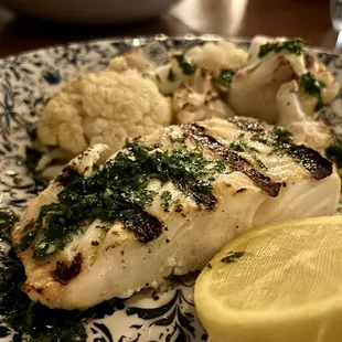 Grilled halibut. Was a nice quality cut of fish but overcooked and really could use a piccata sauce