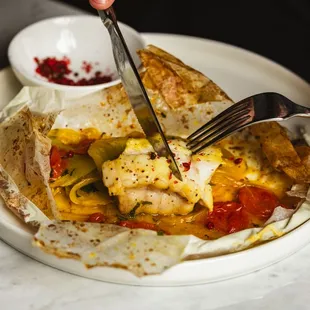 a plate of food being eaten