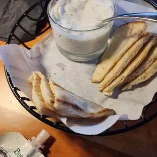 Warm pita with yogurt sauce.