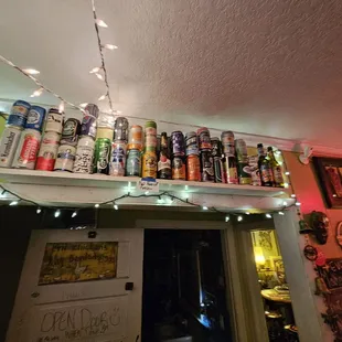 a shelf full of beer cans