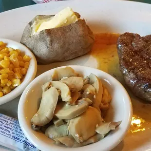 Perfectly cooked 10oz filet that I could cut with a fork. Garlic mushrooms were to die for!