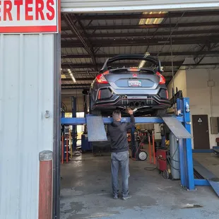 My car on the lift getting rattle checked out.