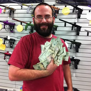 This is the owner handing out cash to customers!