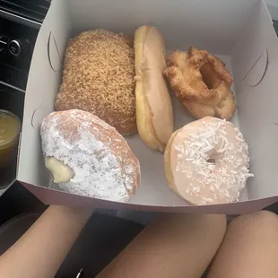 Box of donuts: total 6.75. Powdered custard filled, coconut topped, glazed old fashioned, long maple, and crumb bear claw