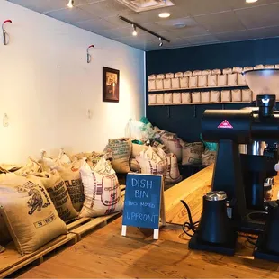 Bags of Green coffee beans waiting to be roasted.