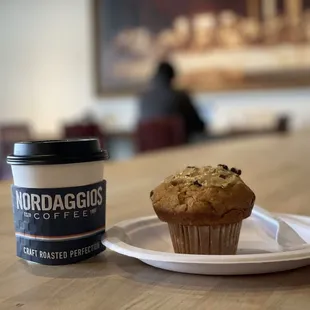 a muffin and a cup of coffee