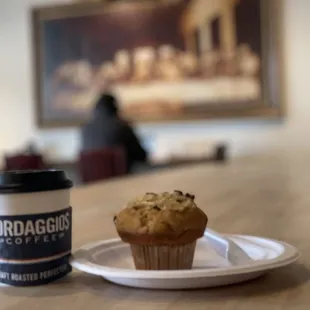 a muffin and a cup of coffee