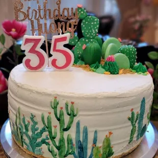 a cake decorated with cacti