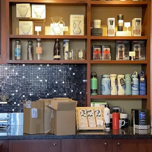 a shelf of coffee mugs